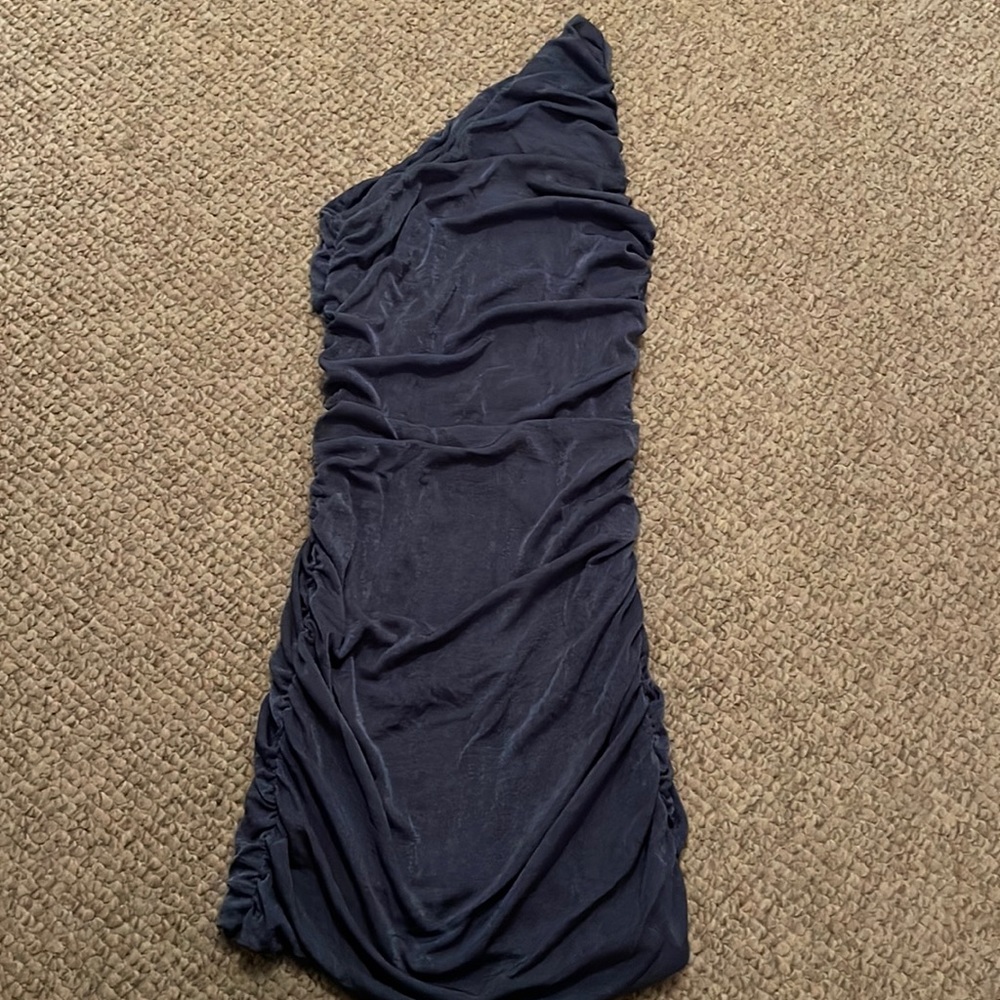 Light blue, tight dress. Never worn. Fits like a glove. Great condition.